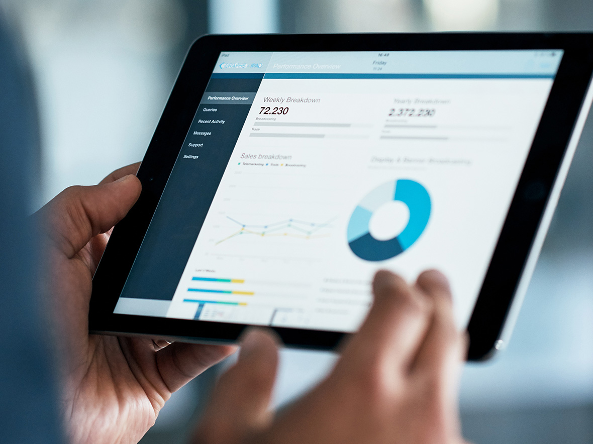 Image of ipad with data dashboard on screen
