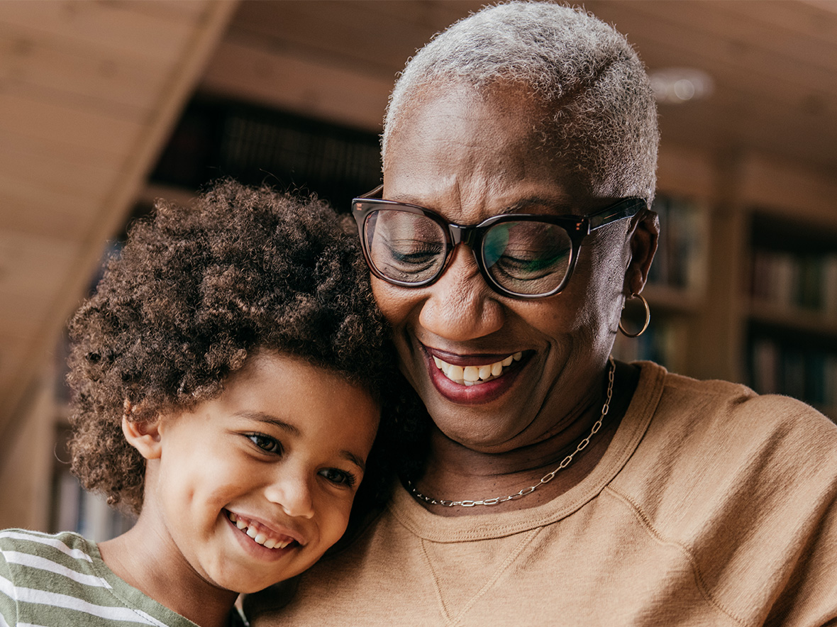 Image of grandmother holding grandchild